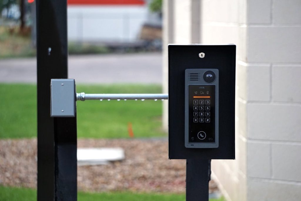 door-intercom-in-residential-building-13007854 Outdoor intercom mounted at a residential building entrance, ensuring security and communication.
